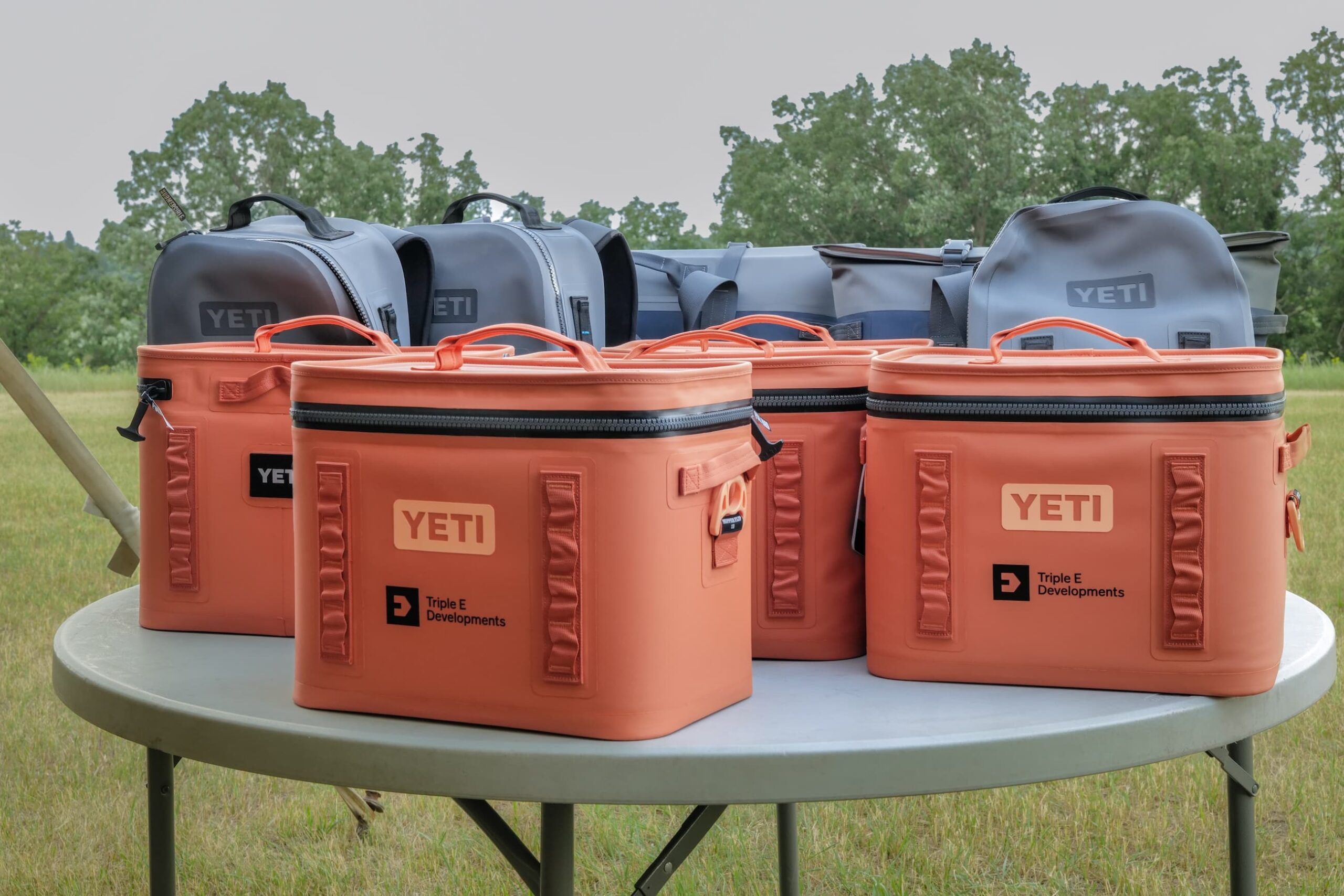 An array of YETI coolers and backpacks as prizes on a table